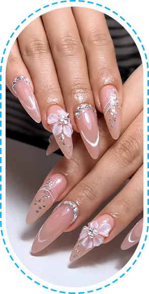 Close-up of elegant pink French-style nails with decorative details.