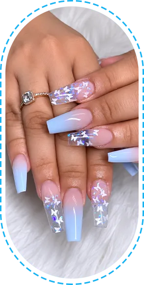 Close-up of pink and purple decorated manicured nails.